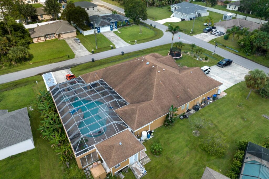 Covered lanai with pool access and space for an outdoor kitchen layout