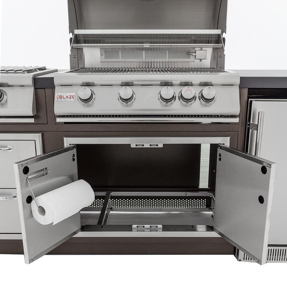 Existing outdoor kitchen cabinet doors and interior being checked before a built-in grill replacement