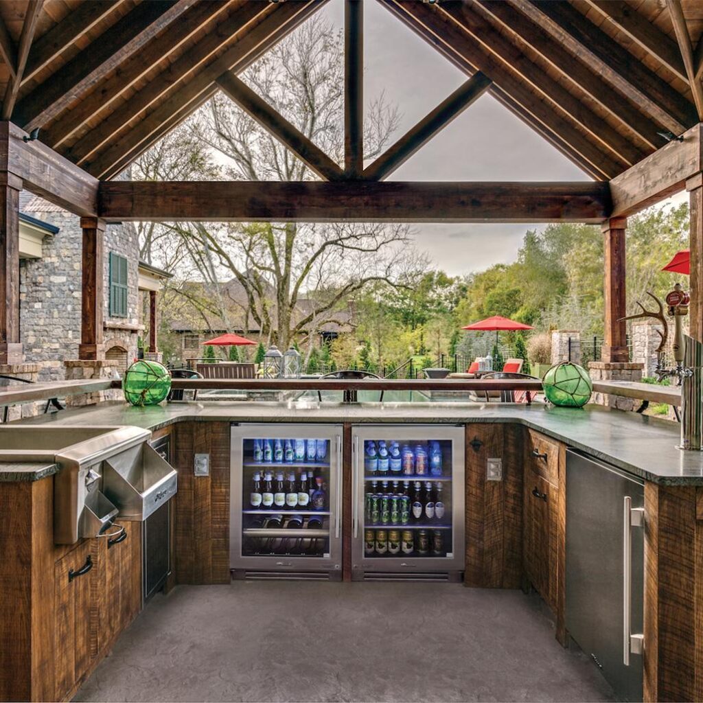 Outdoor kitchen layout showing an undercounter beverage cooler near a seating and entertaining area